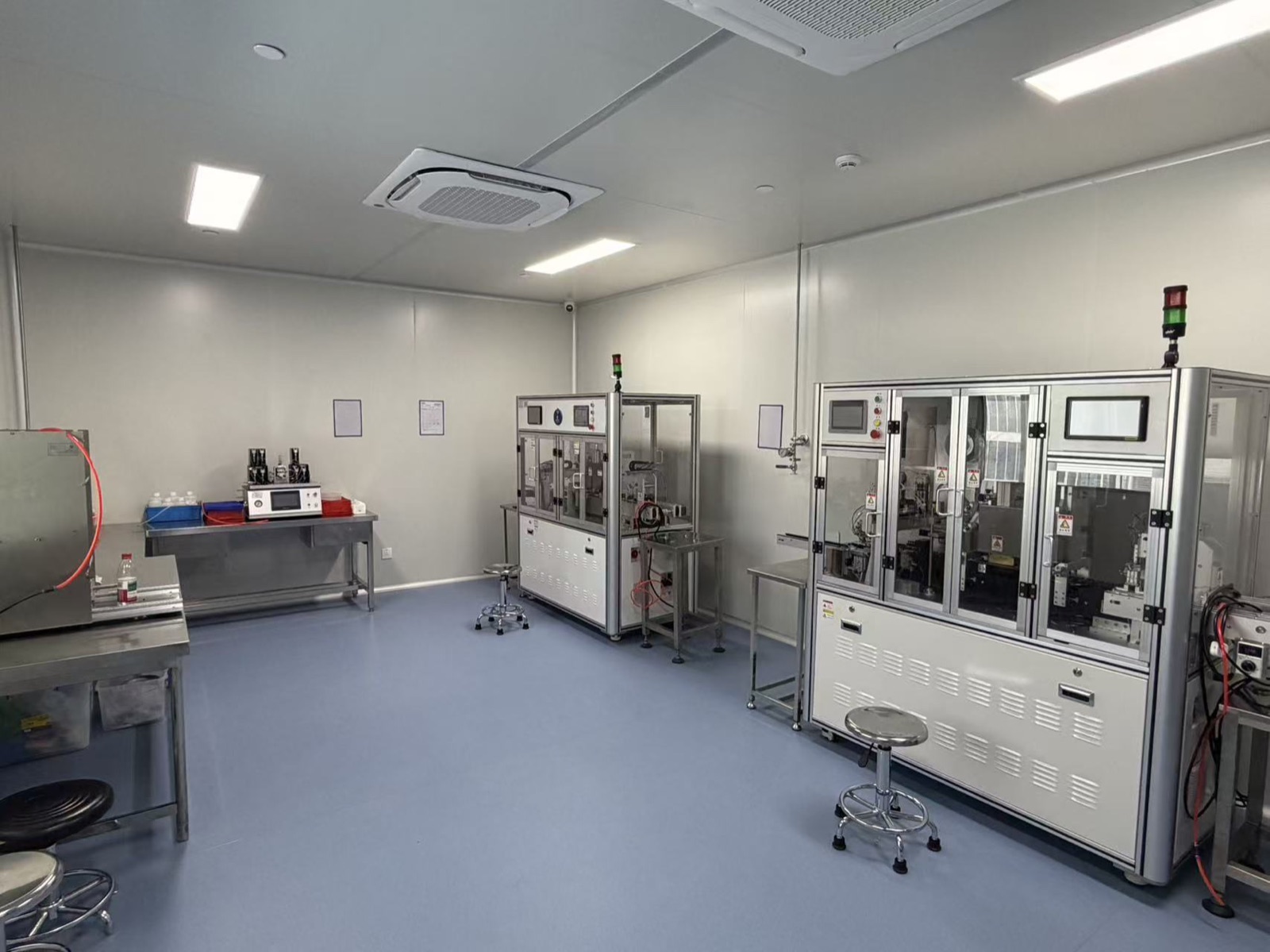 Automated research-material manufacturing equipment in a controlled production room